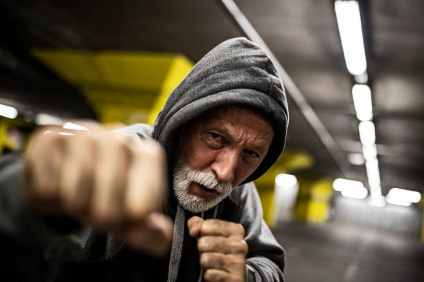 Senior male fighter boxing